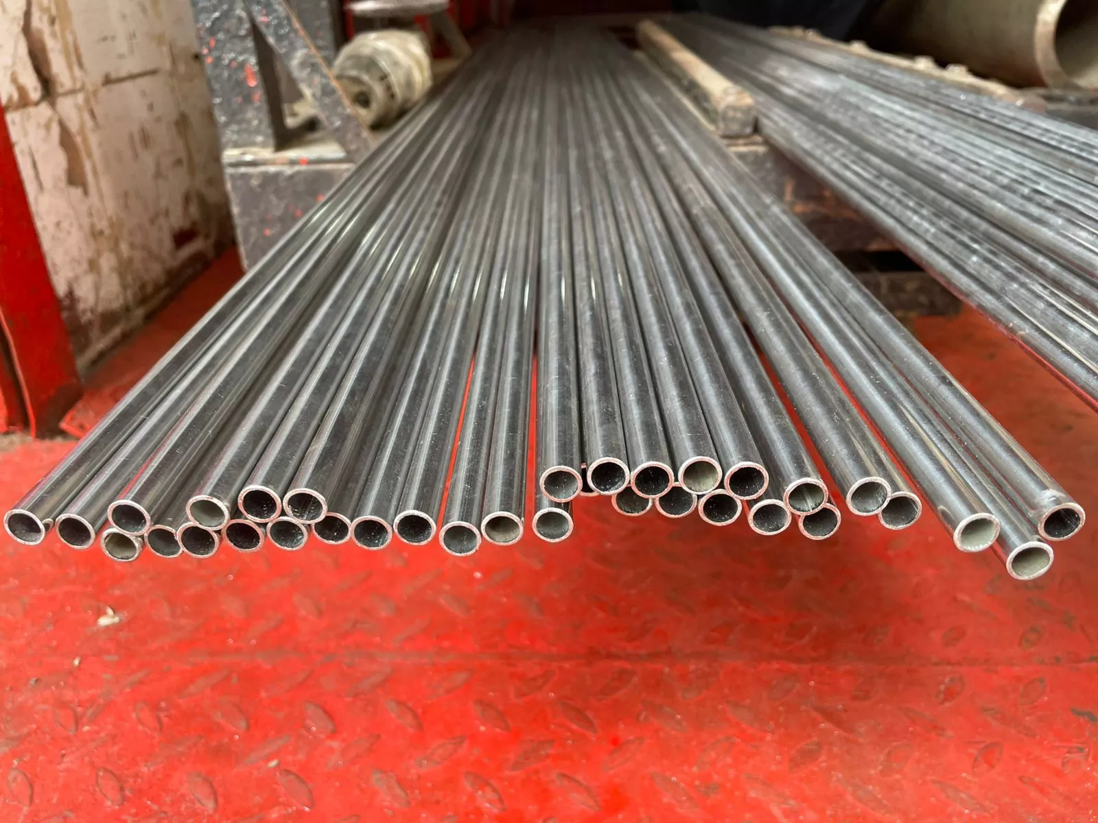Stainless steel tubes fanned out showing bore diameter