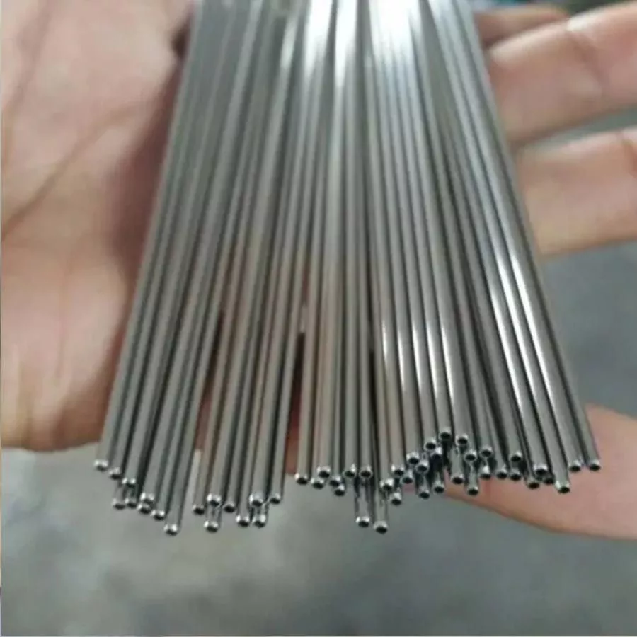 Stainless steel tube sample held for inspection